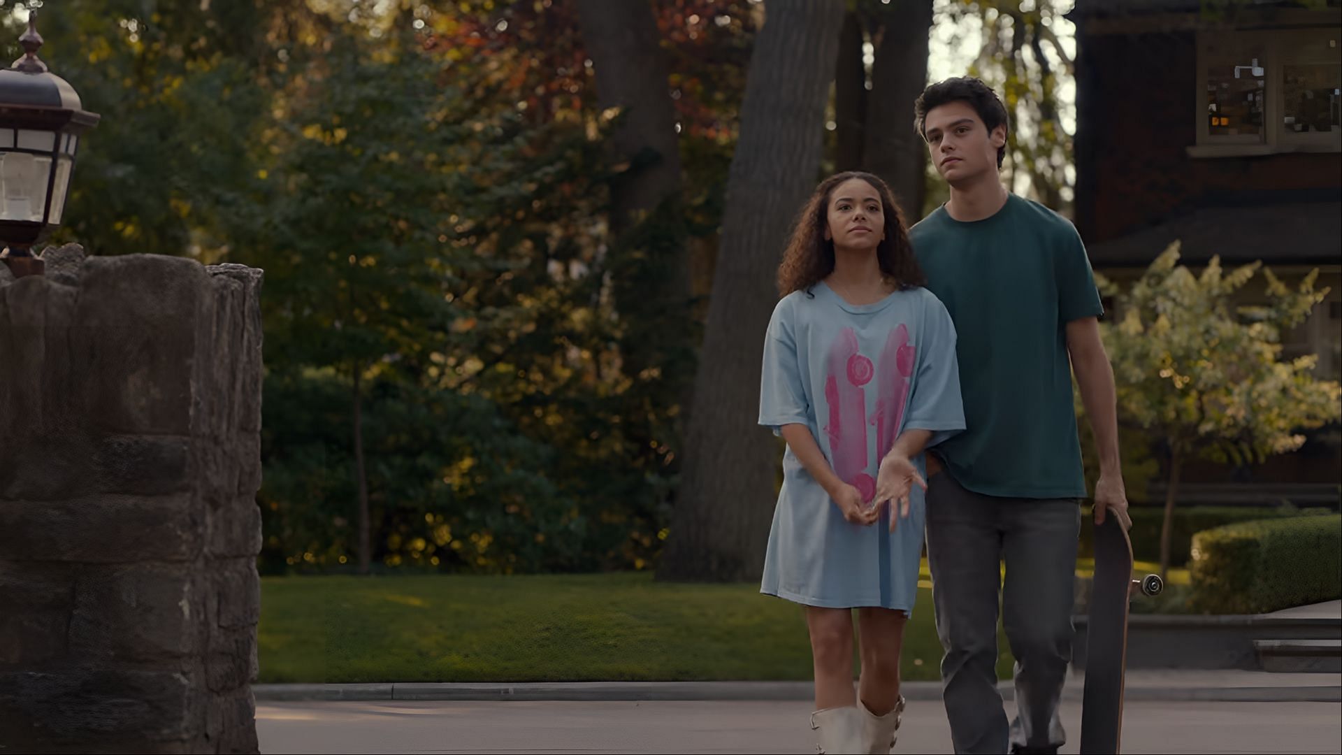 Marcus and Ginny walk side-by-side through Wellsbury, symbolizing the fragile yet persistent connection they share throughout Ginny & Georgia season 3 (Image via Netflix)